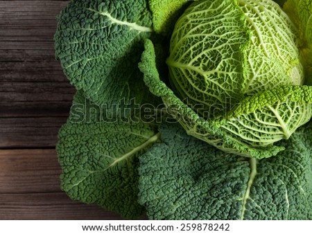 Savoy cabbage super food close up. Top view Royalty-Free Stock Photo #259878242