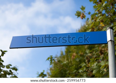 Blank blue street sign.