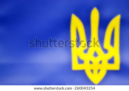 Blurred yellow and blue background of symbol of Ukraine - a trident in national colours