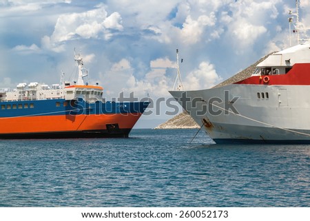 Ships in the bay on the background of the steep bank and the sea