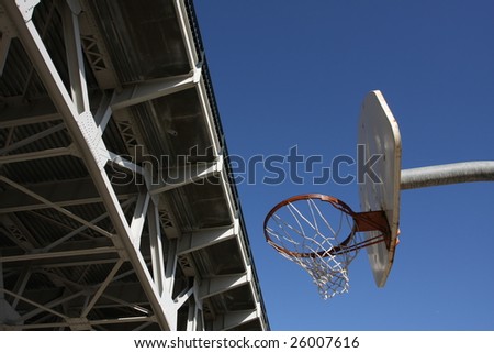 Basketball Hoop under a bridge