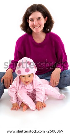 Mother and young baby daughter pose for their first family Halloween portrait. Baby is wearing a pink Octopus Halloween costume.