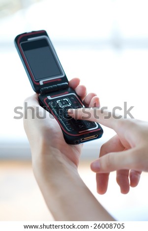 Closeup of hand texting on mobile phone