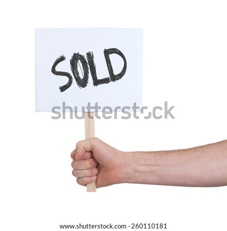Hand holding sign, isolated on white - Sold