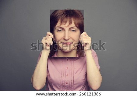 woman holding poster with emotion