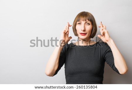 woman crossed her fingers for luck