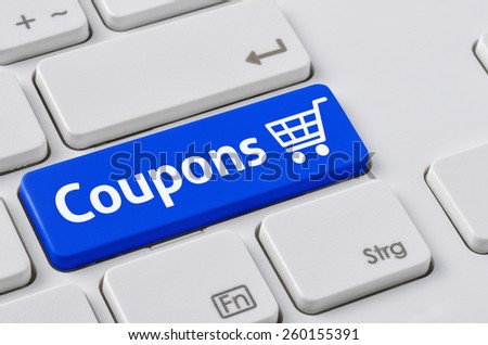 A keyboard with a blue button - Coupons