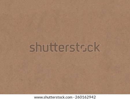 Seamless background of brown craft paper texture.