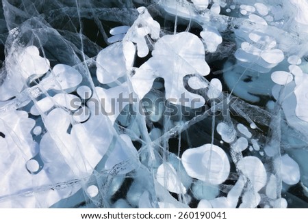 Lake Baikal. Funny pictures of bubbles in transparent ice. Natural background