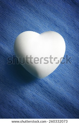 White egg in the shape of heart