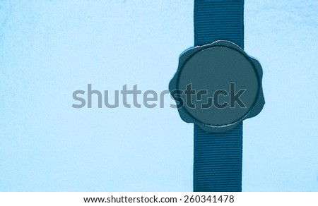 Leather seal on ribbon as present decoration