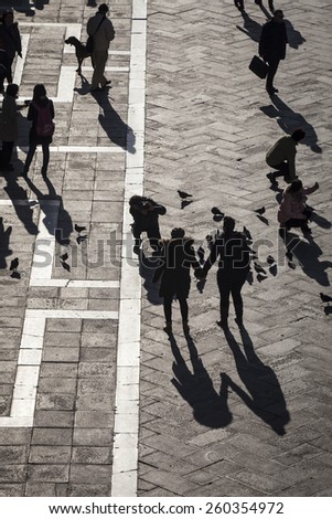 Aerial view of San Marco Piazza (Saint Marc Square): Shadow of tourists on the square
