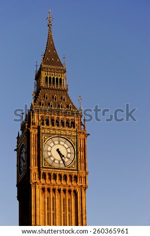 Big Ben in the sunny day with blue sky background. Vertical orientation. 