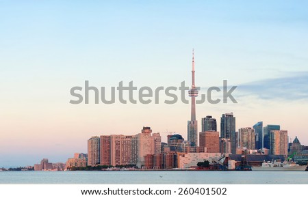Toronto sunrise with sunlight reflection over lake in the morning