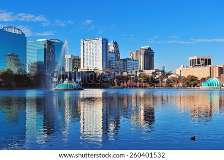 Orlando Lake Eola in the morning with urban skyscrapers and clear blue sky. Royalty-Free Stock Photo #260401532