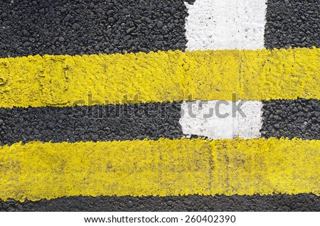 Traffic lines on the asphalt road surface is composed of one type of background./ Traffic lines