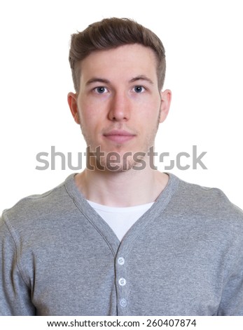 Portrait of a smiling guy in a grey shirt