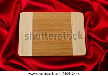 chopping board on red abstract background luxury cloth 