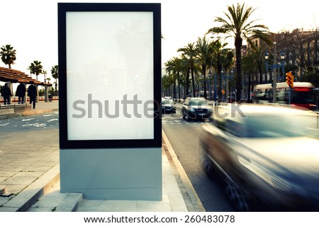 Blank billboard outdoors, outdoor advertising, public information board on city road, filtered image, cross process Royalty-Free Stock Photo #260483078