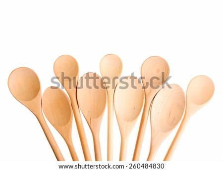 Wooden spoons on white background.