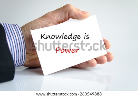 Knowledge is power note in bussines man hand
