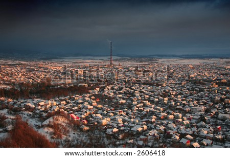 A snowed city at dusk
