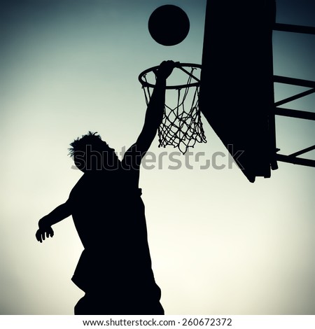 Vignetting Photo of the Silhouette a Basketball Player