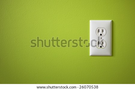 white electric outlet mounted on green wall Royalty-Free Stock Photo #26070538