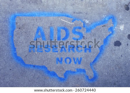 Aids Research sign on sidewalk