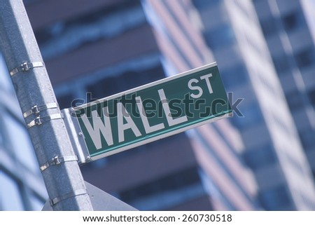 A sign that reads "Wall Street" for Business on Wall Street, NY, NY