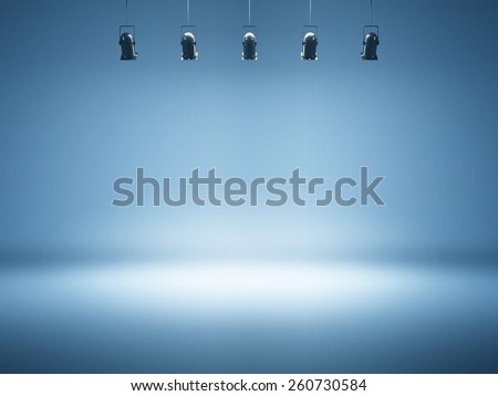 blue spotlight background with studio lamps