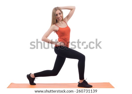 Young woman in sportswear training back and legs on a mat on white background.