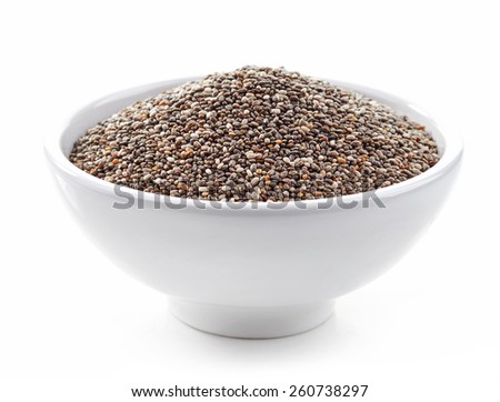 bowl of healthy chia seeds isolated on white Royalty-Free Stock Photo #260738297