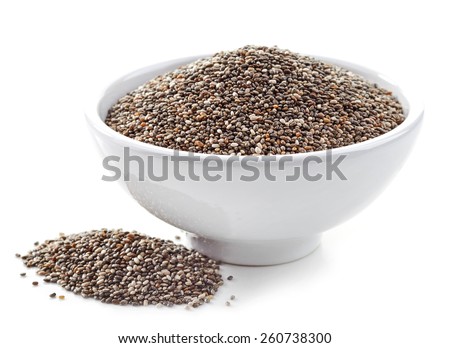 bowl of healthy chia seeds isolated on white Royalty-Free Stock Photo #260738300