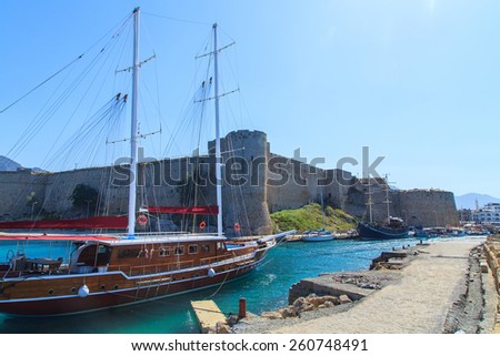 Boats in a port in Kyrenia (Girne) with castle in the background, Cyprus