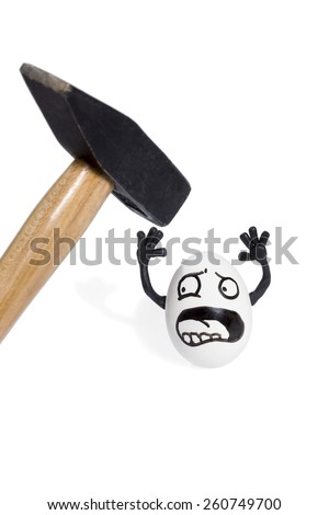 Egg with a painted face raised upper arm before hitting it with a hammer isolated on a white background