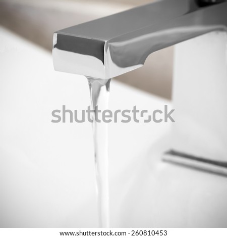 Faucet in bathroom, water is running