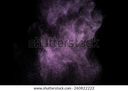  Abstract purple powder explosion on black background.