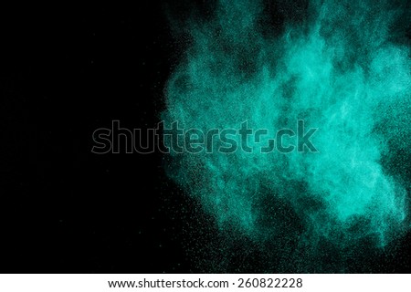  Abstract aquamarine powder explosion on black background.