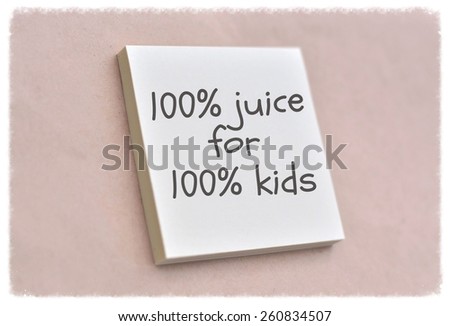 Text 100% juice for 100% kids on the short note texture background