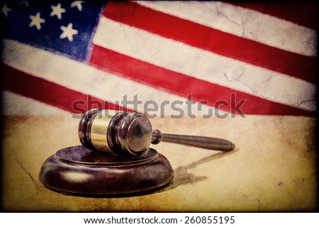 Gavel on a background of the American flag Royalty-Free Stock Photo #260855195
