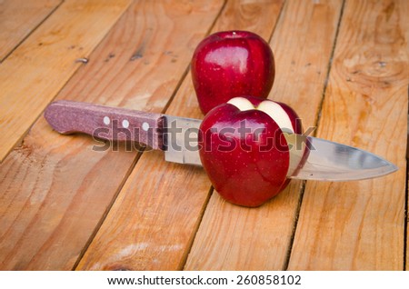 red apple on wood background,Apple Sliced