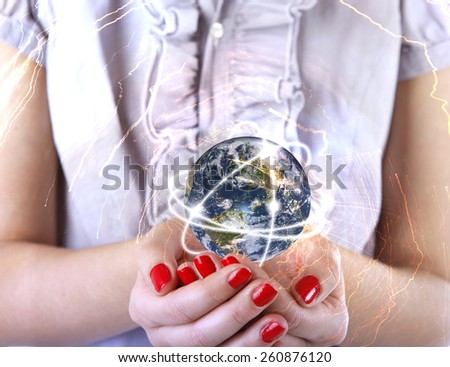 Business woman holds Earth in hands