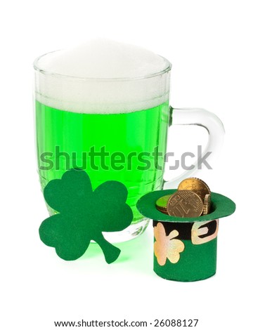 Mug of Green beer, shamrock and Leprechaun hat with coins for St Patrick's Day