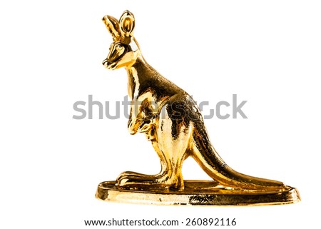 a golden kangaroo figurine isolated over a white background