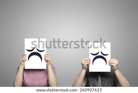 woman and man holding posters