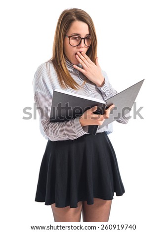 Surprised girl reading book 