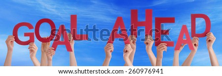Many Caucasian People And Hands Holding Red Letters Or Characters Building The English Word Go Ahead On Blue Sky