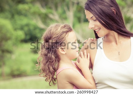 Happy mother and daughter playing in the park at the day time. Concept of celebration Mothers day .