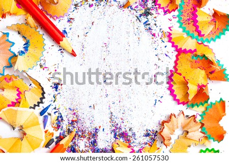 ART word on the background of colored pencil shavings and pencil red